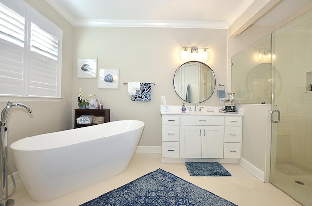 full bathroom with a freestanding tub, a stall shower, ornamental molding, baseboards, and vanity