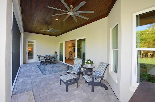 view of patio / terrace featuring outdoor dining area and a ceiling fan