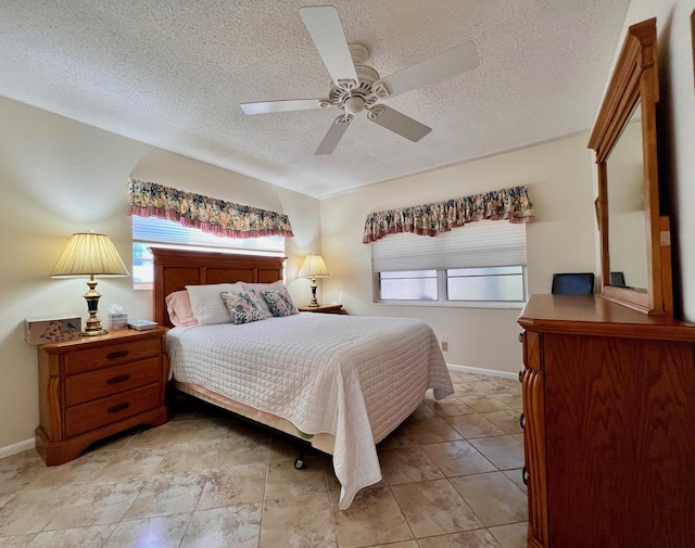 156 Bedford F, West Palm Beach, FL 33417 - bedroom with baseboards, a textured ceiling, and a ceiling fan