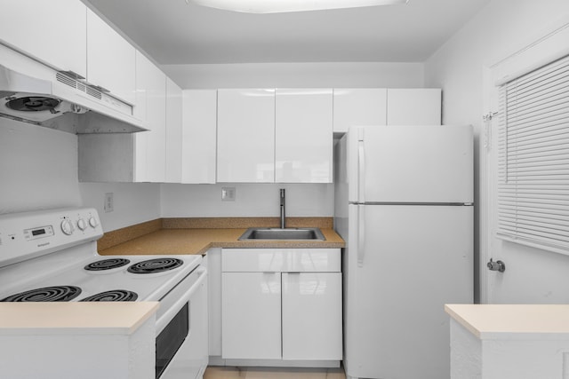 kitchen featuring white appliances, a sink, light countertops, under cabinet range hood, and white cabinetry