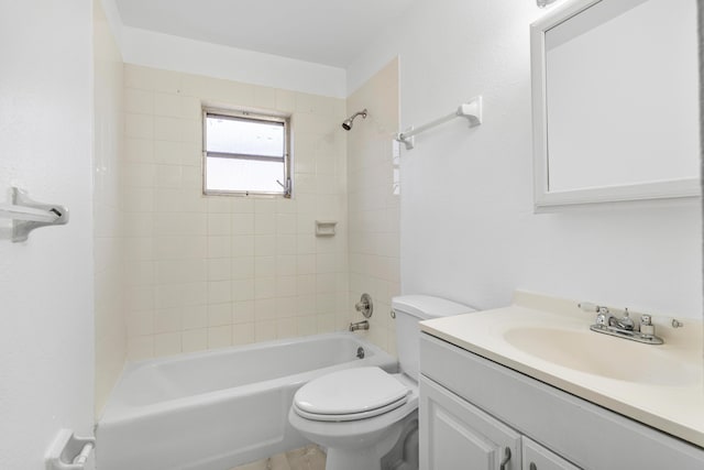 bathroom with washtub / shower combination, toilet, and vanity