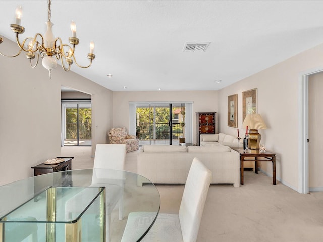 carpeted dining area with a notable chandelier, visible vents, and baseboards