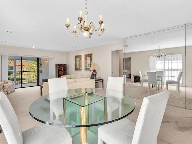 dining space with a wealth of natural light and a chandelier