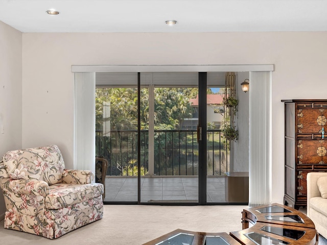 entryway featuring a wealth of natural light, recessed lighting, and carpet floors