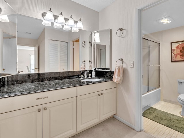 full bath with toilet, vanity, baseboards, and bath / shower combo with glass door