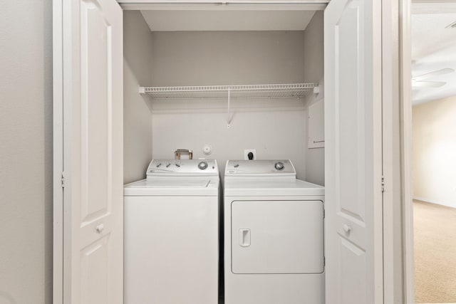 washroom featuring laundry area and washing machine and dryer