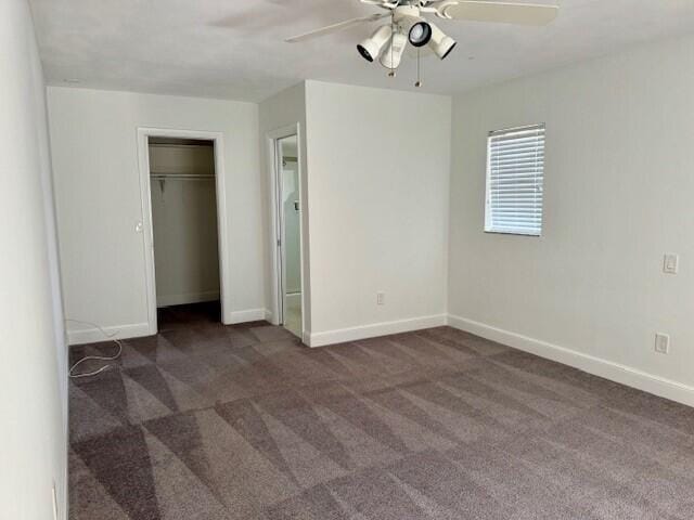 unfurnished bedroom with a closet, a ceiling fan, baseboards, and carpet floors