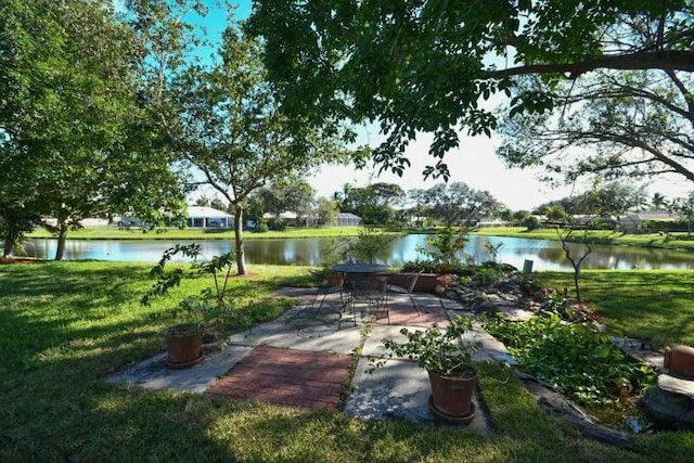 view of patio with a water view