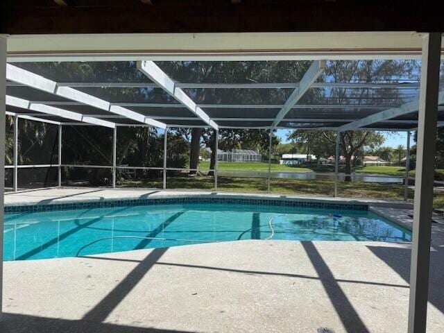 outdoor pool featuring a patio area and a lanai