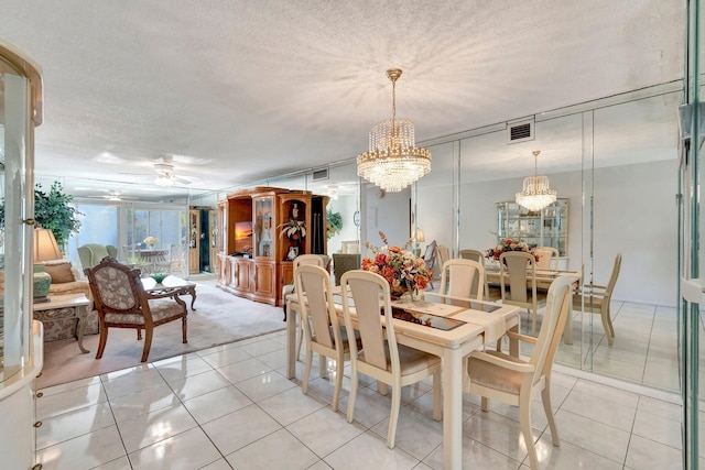 2901 Victoria Cir Unit F2, Coconut Creek, FL 33066 - dining space featuring a chandelier, light tile patterned floors, ceiling fan, light colored carpet, and a textured ceiling