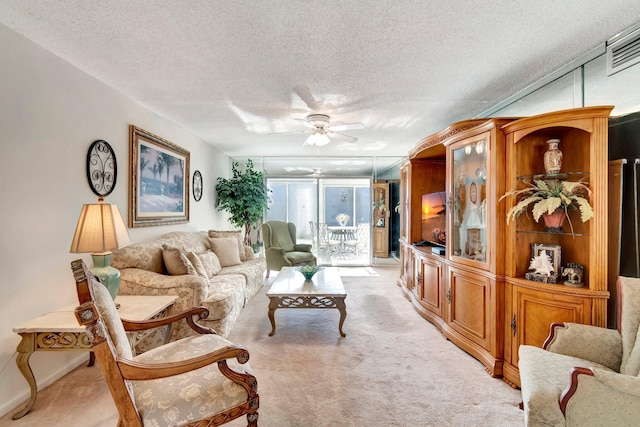 2901 Victoria Cir Unit F2, Coconut Creek, FL 33066 - living area featuring a ceiling fan, a textured ceiling, and light carpet
