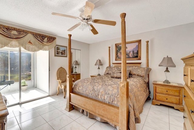 bedroom with ceiling fan, access to outside, light tile patterned floors, and a textured ceiling