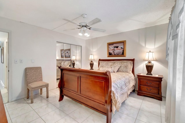 bedroom featuring light tile patterned floors and ceiling fan