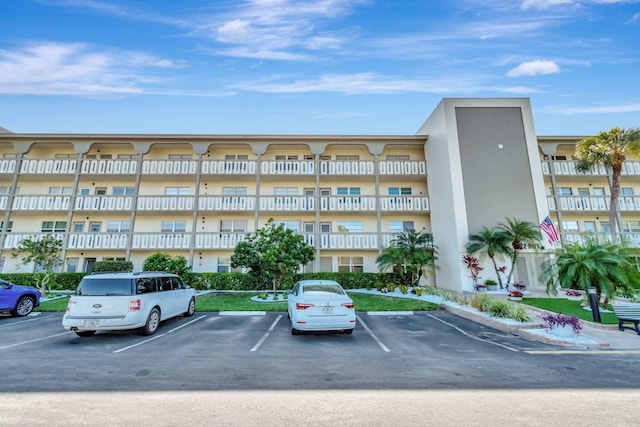 view of property with uncovered parking