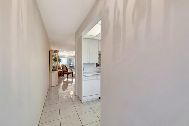 corridor featuring light tile patterned flooring