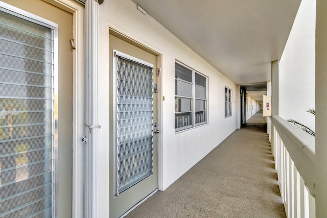 property entrance with stucco siding