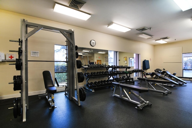 gym with baseboards and visible vents