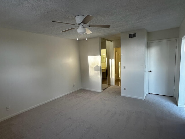 unfurnished bedroom with baseboards, visible vents, and a textured ceiling