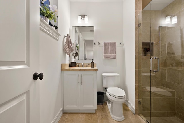 bathroom featuring vanity, baseboards, a stall shower, tile patterned floors, and toilet