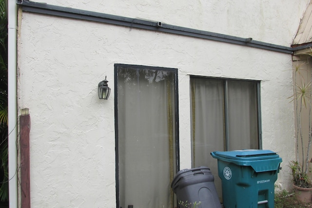 view of side of home featuring stucco siding