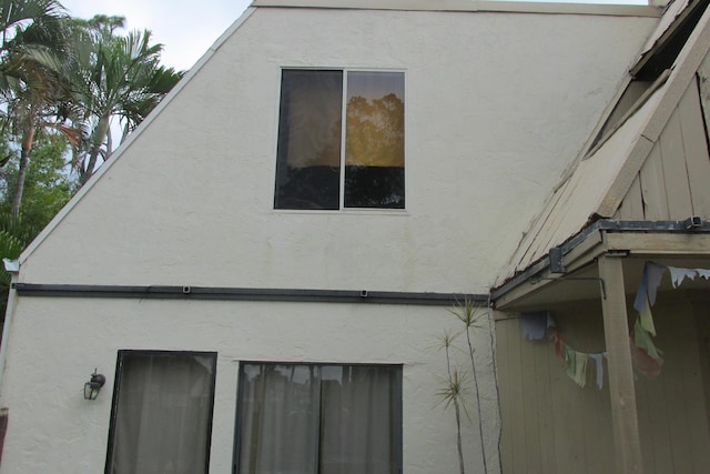 view of home's exterior with stucco siding