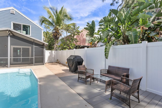 view of pool featuring a fenced in pool, an outdoor hangout area, a fenced backyard, a sunroom, and area for grilling