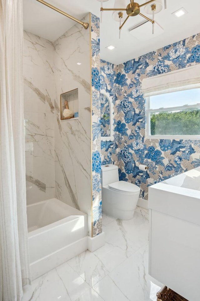 bathroom featuring an inviting chandelier, shower / bath combo with shower curtain, toilet, and marble finish floor