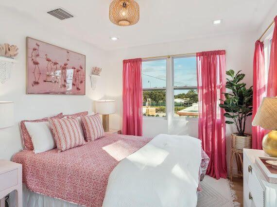 bedroom featuring visible vents