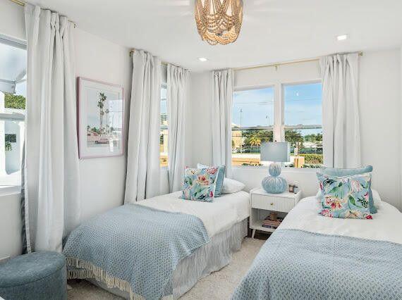 bedroom featuring an inviting chandelier