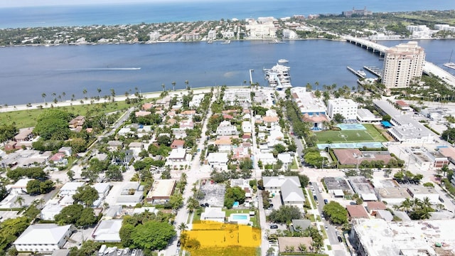 birds eye view of property with a water view