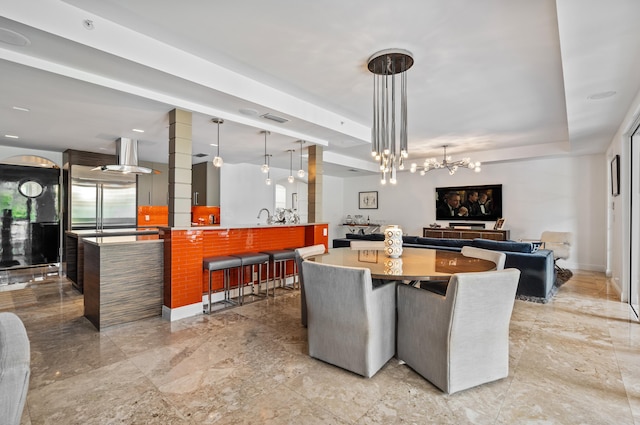 dining space featuring visible vents, marble finish floor, a raised ceiling, and baseboards