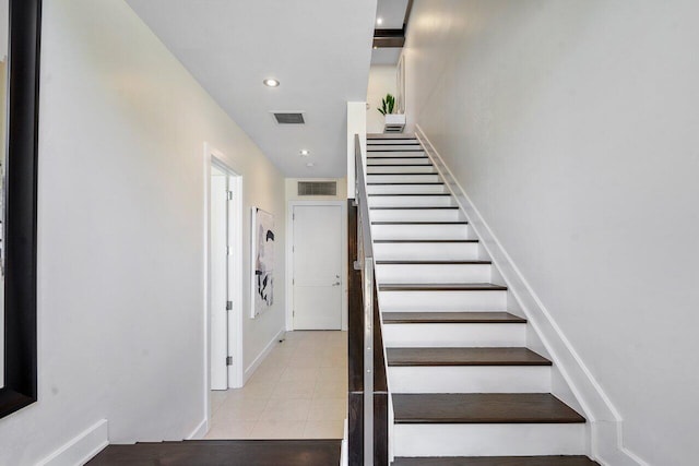 staircase with recessed lighting and visible vents