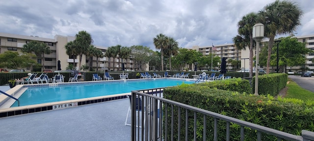 community pool with fence