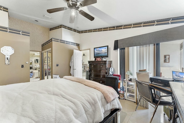 bedroom featuring light tile patterned floors, a ceiling fan, and visible vents