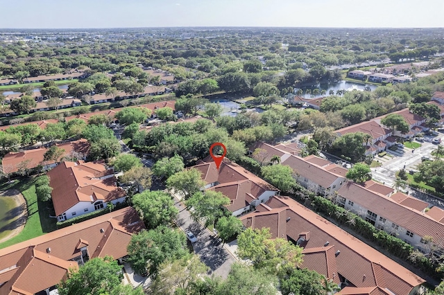 drone / aerial view featuring a residential view and a water view