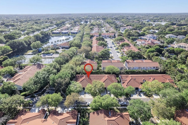 birds eye view of property with a water view and a residential view