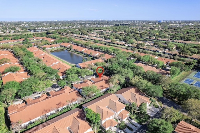 drone / aerial view with a residential view and a water view