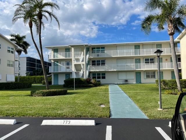 view of property with uncovered parking