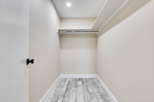 spacious closet with wood finished floors