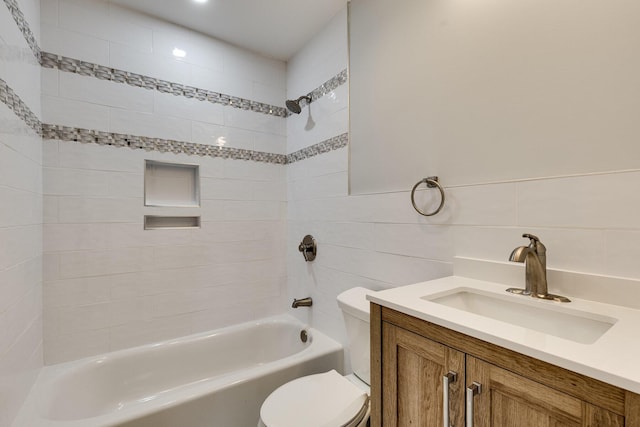 full bath featuring vanity, toilet, and bathing tub / shower combination