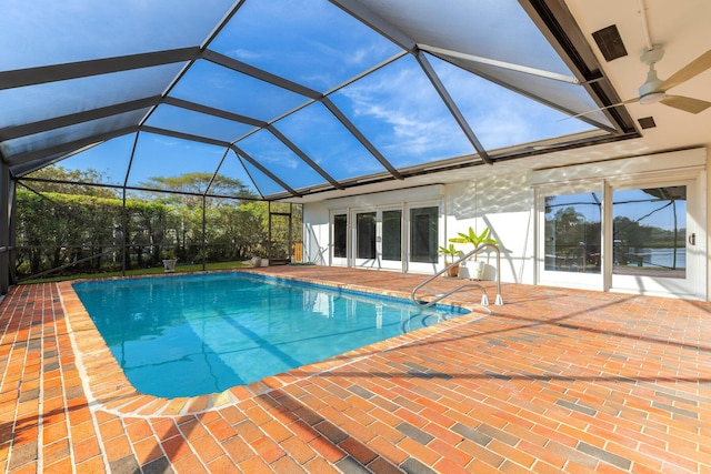 pool with a lanai, french doors, a ceiling fan, and a patio