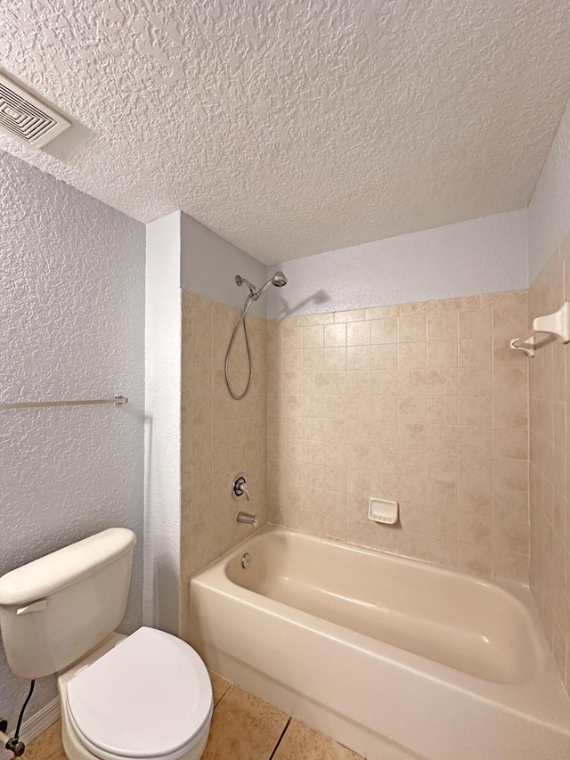 full bathroom featuring visible vents, toilet, shower / bath combination, tile patterned floors, and a textured ceiling