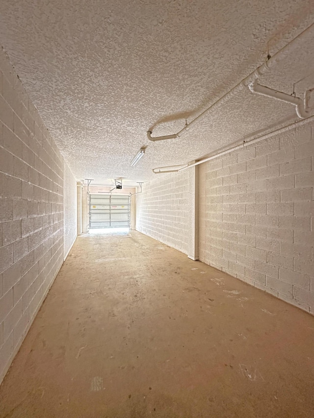 garage with concrete block wall