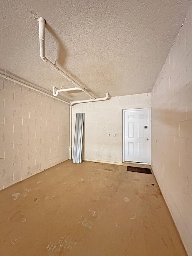 garage featuring concrete block wall