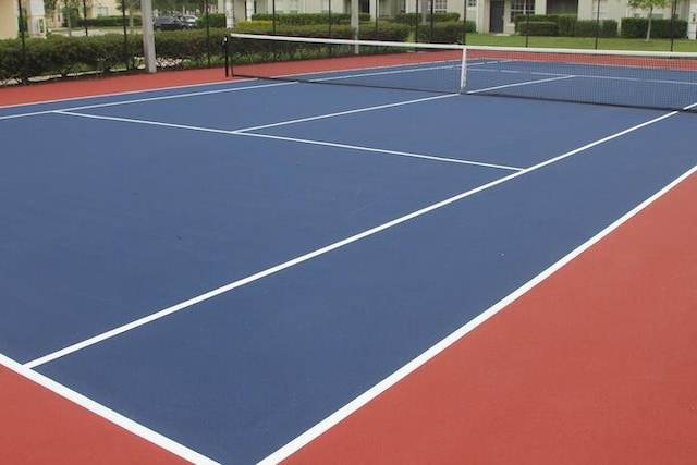 view of tennis court featuring community basketball court