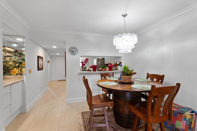 dining room with baseboards, light wood-style flooring, recessed lighting, ornamental molding, and a chandelier