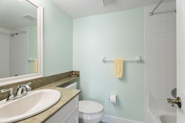 bathroom featuring visible vents, toilet, vanity, and bathing tub / shower combination