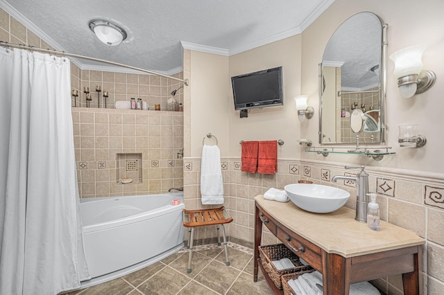 full bath with shower / bathtub combination with curtain, a textured ceiling, tile walls, and ornamental molding