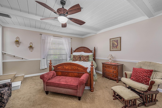 carpeted bedroom featuring beamed ceiling, wooden ceiling, baseboards, and a ceiling fan