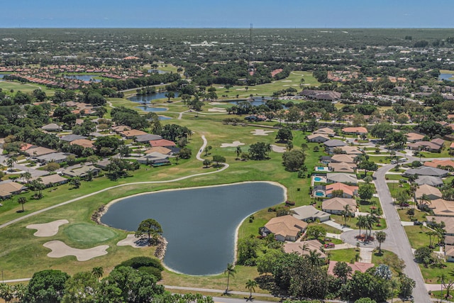 aerial view with a residential view, a water view, and view of golf course